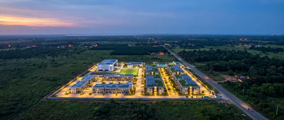 Concept aerial of the compact, walled smart industrial city beside the Epe–Itokin road, in flat bush and oil palms